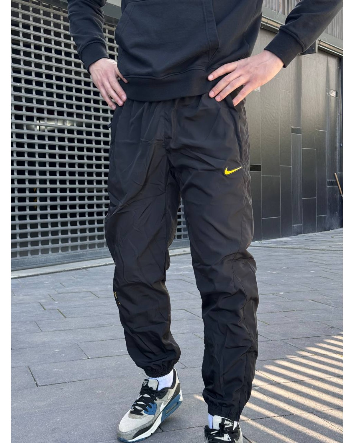 Спортивні штани Nike × Drake Nocta NRG WOVEN TRACK PANTS BLACK Yellow