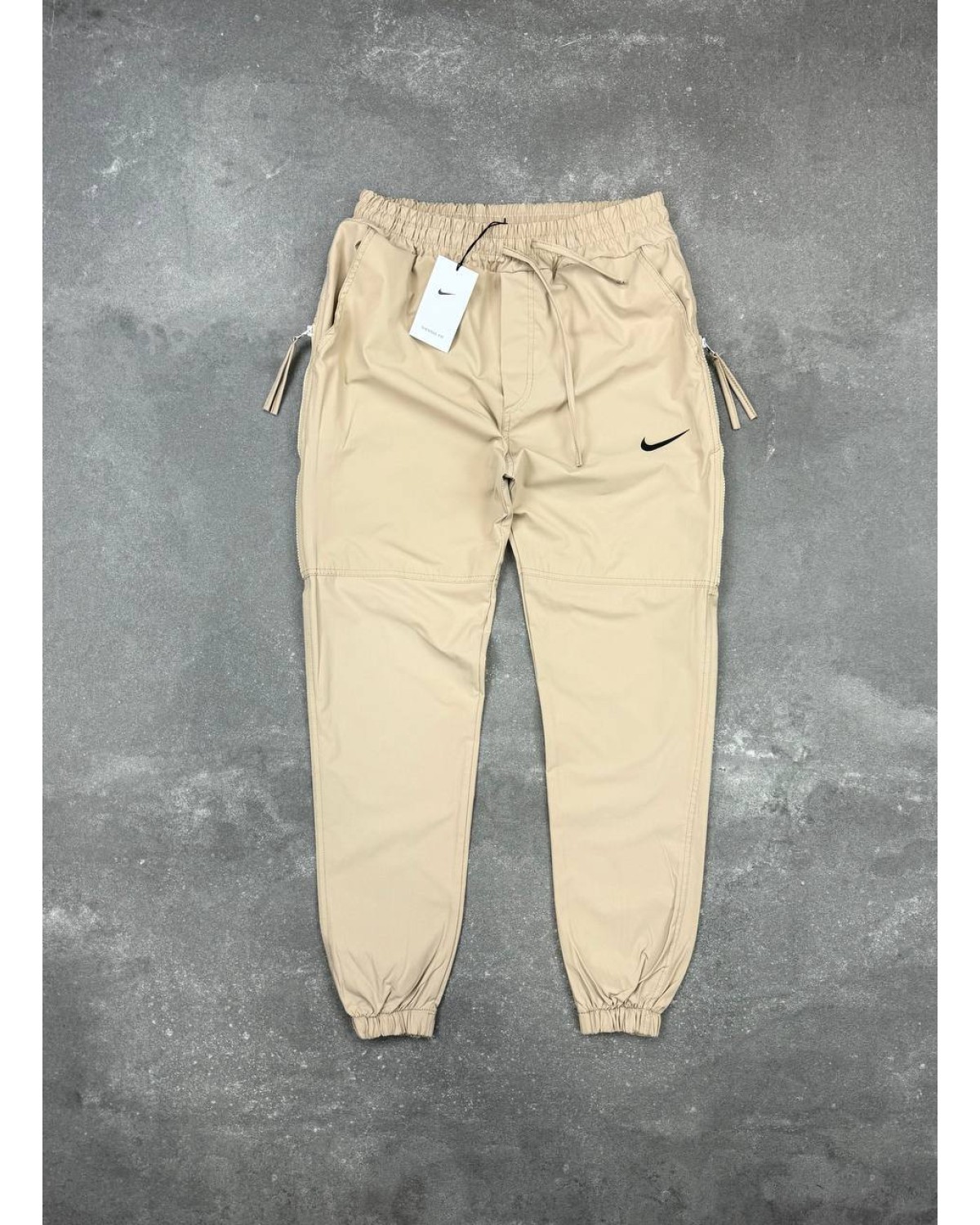 Штани Nike бежеві